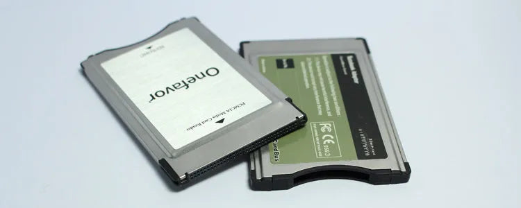 SD to PCMCIA adapter card with stainless steel housing and inserted 32GB SD card for Mercedes-Benz vehicles.