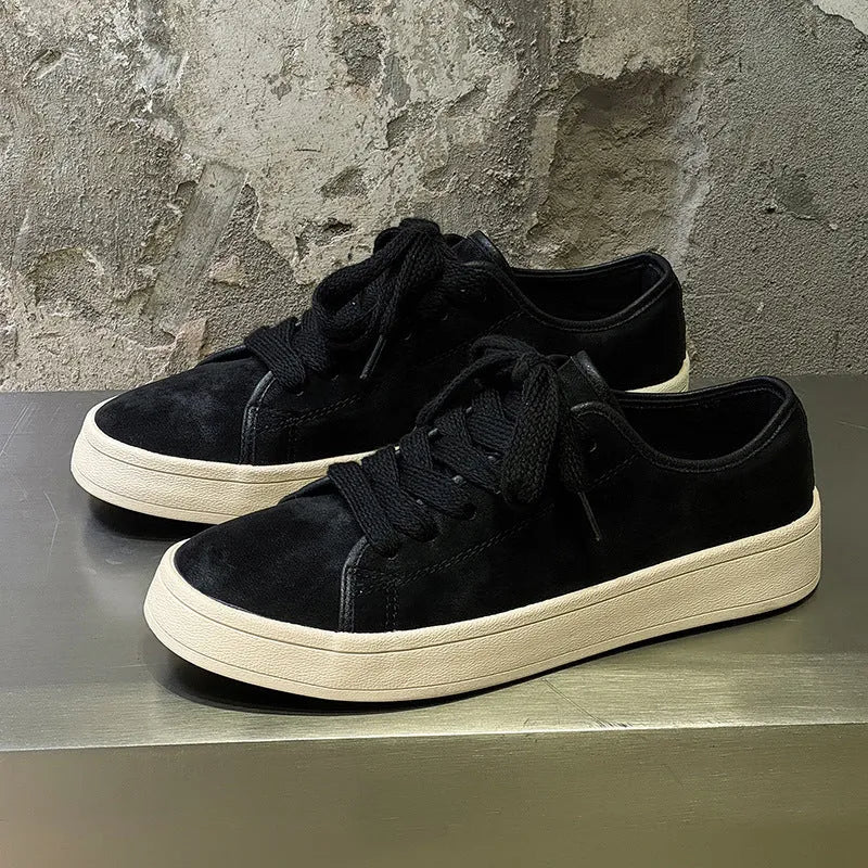 Breathable matte leather sports casual shoes in black with stitched detailing, low-top profile, and rubber sole