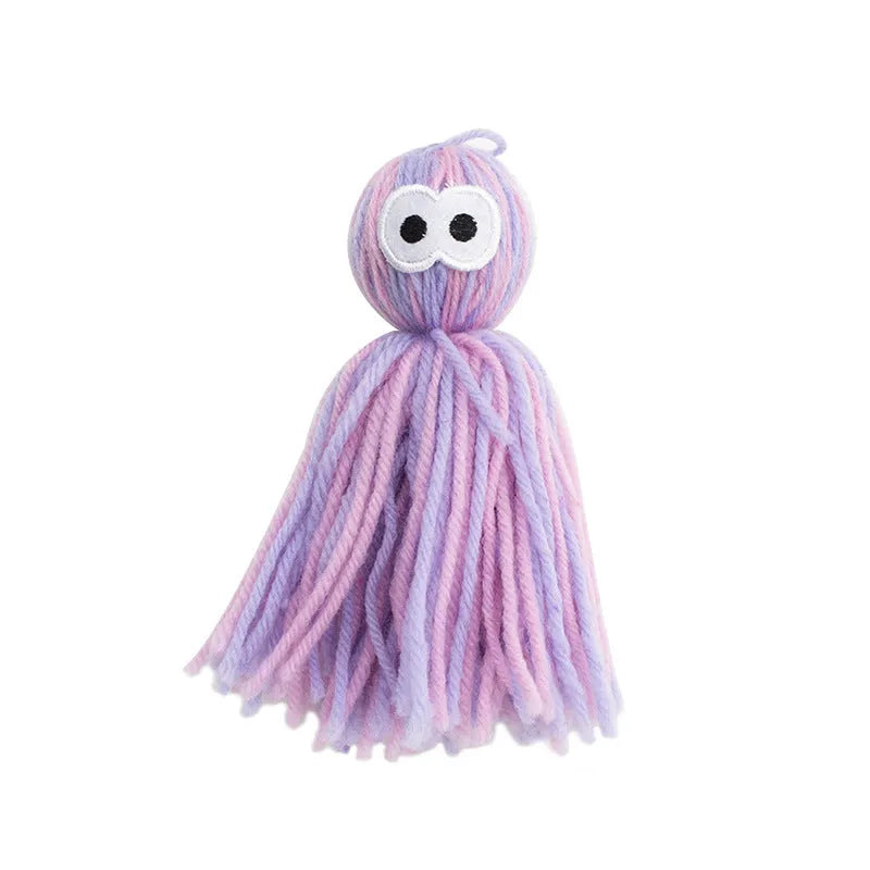 Wool cat ball toy with teaser stick attachment in blue-grey colour variation