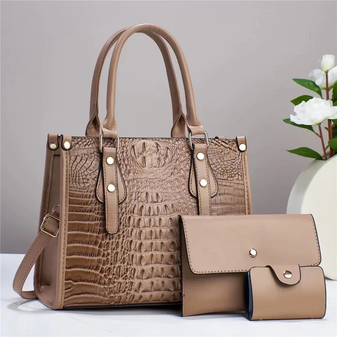 Contrast colour minimalist textured three-piece set showing crossbody bag, wallet, and card holder in burgundy.
