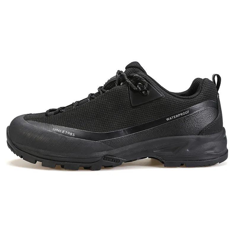 Men's low-top hiking boots in black with a rubber outsole and lace-up front.