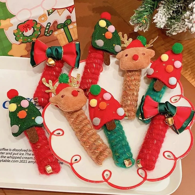 Children Christmas hair ties with red bell, green tree, khaki elk, and red tree designs on a light background