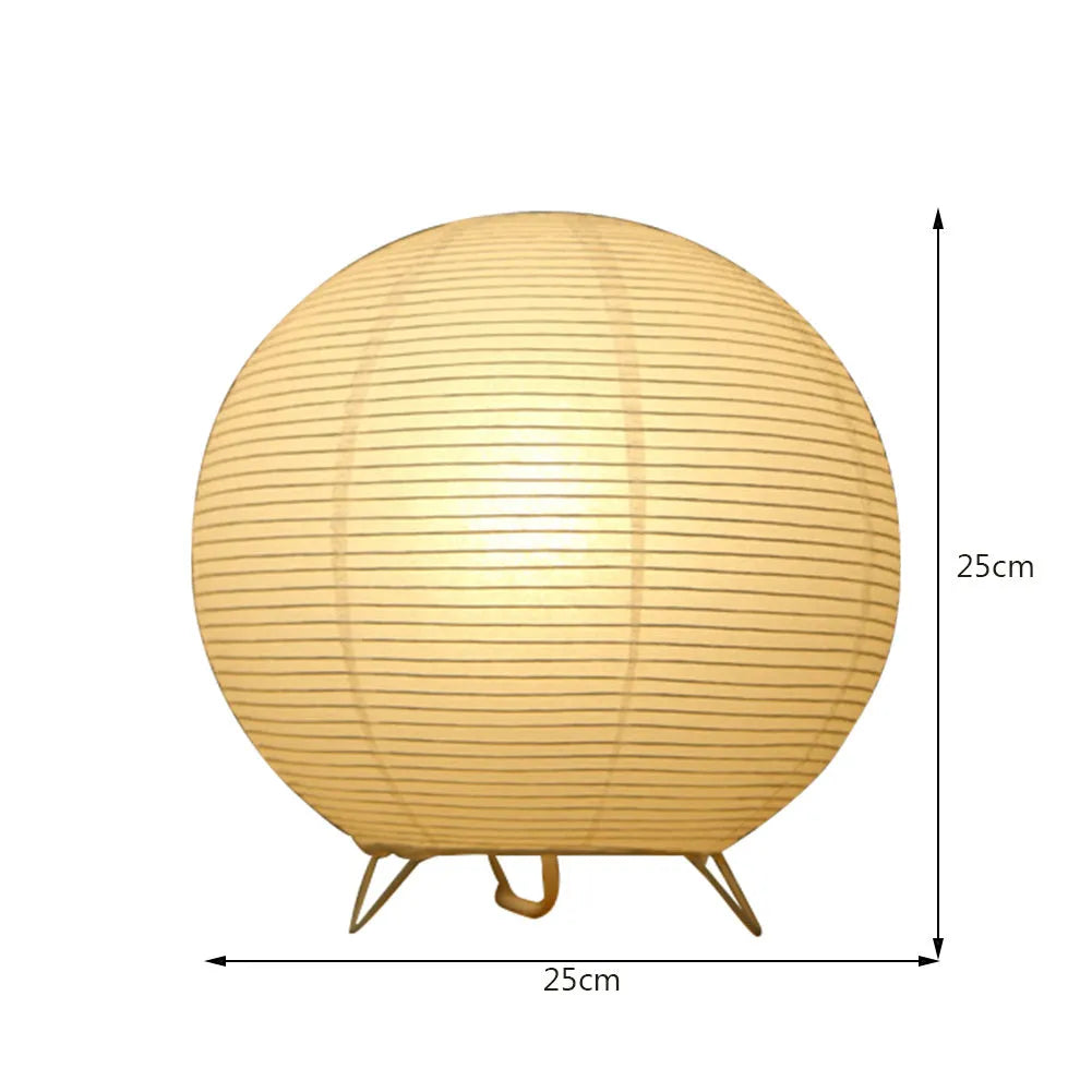 Traditional handmade rice paper table lamp with E14 bulb fitting on bedside table