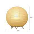 Traditional handmade rice paper table lamp with E14 bulb fitting on bedside table