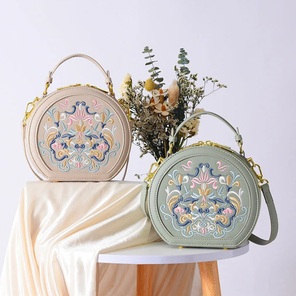 Round PU crossbody bag with embroidery, peacock blue colour, small size, front view