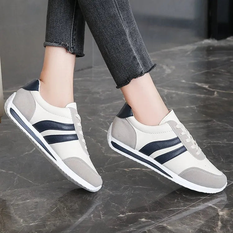 Red and blue low top lace-up leisure sneaker with PU mesh upper and rubber sole.