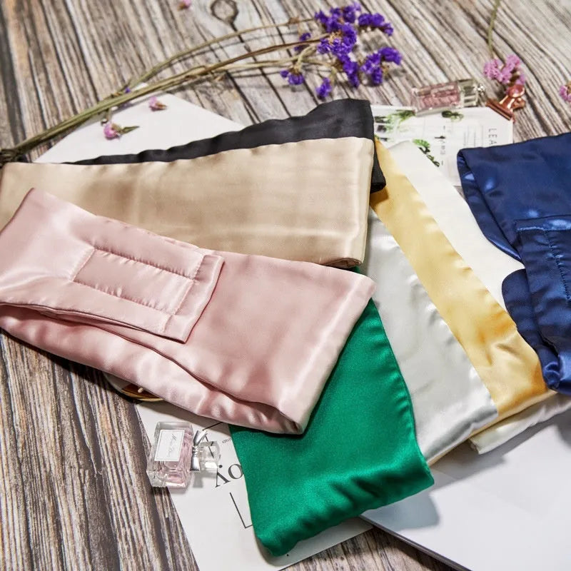 Mulberry silk sleep eye mask shown in various colours including black, champagne gold, and navy blue