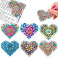Set of six handmade leather bookmarks with crystal flower designs.