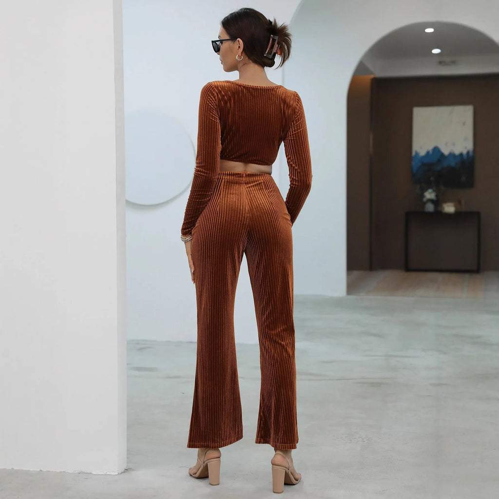 Caramel coloured long sleeve sweater and trousers co-ord set on a hanger