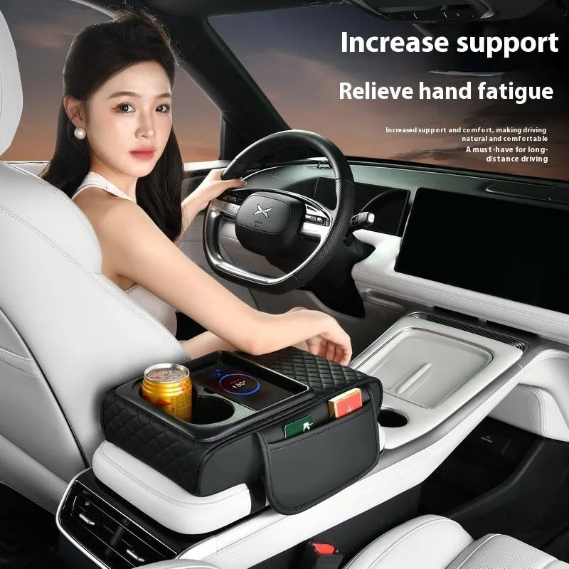 Leather car armrest box cover with wireless charging pad, tissue storage, and cup holder in black.