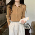 Gentle long-sleeved knitted cardigan in viscose fibre, shown in loose fit on a model.