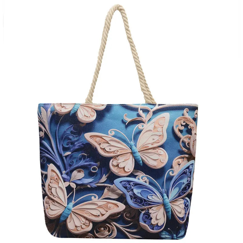 A soft cotton and linen string shoulder handbag with two straps and an open outer pocket.