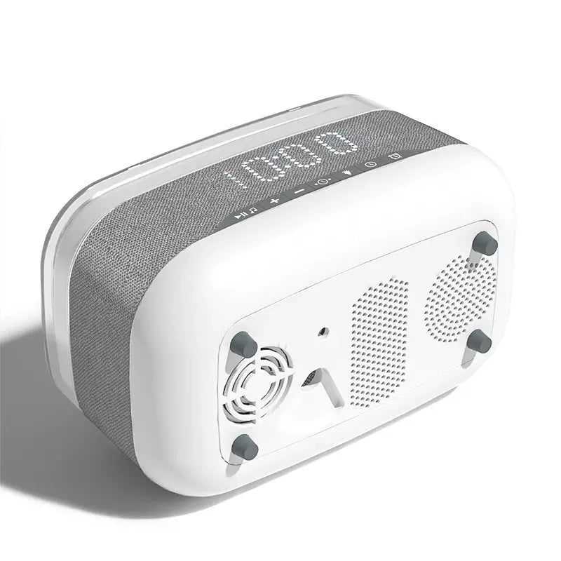 White multifunctional alarm clock with Bluetooth speaker and wireless charging pad showing night light illumination