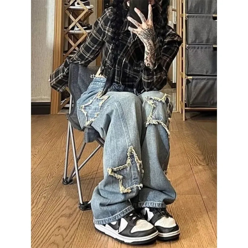Blue high-waisted women's wide-leg denim jeans on a model, showing the straight-leg cut.