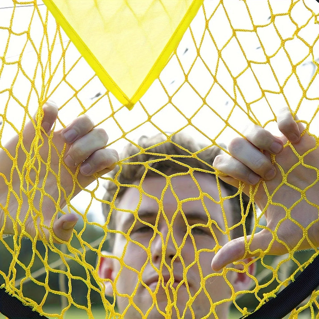 Black portable soccer training goal net with fibreglass poles set up on grass for practice.