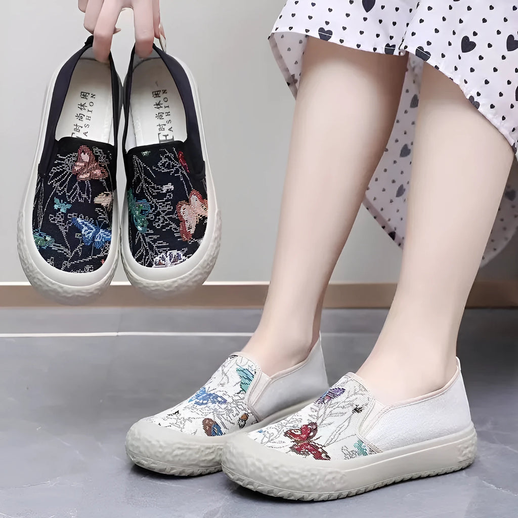 Women's canvas slip-on shoes with plastic injection-moulded sole and decorative sewing thread details