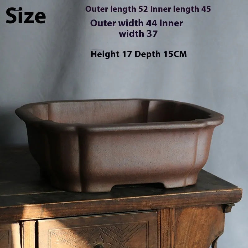 Purple sand rectangular bonsai flower pot with modern geometric design on floor surface