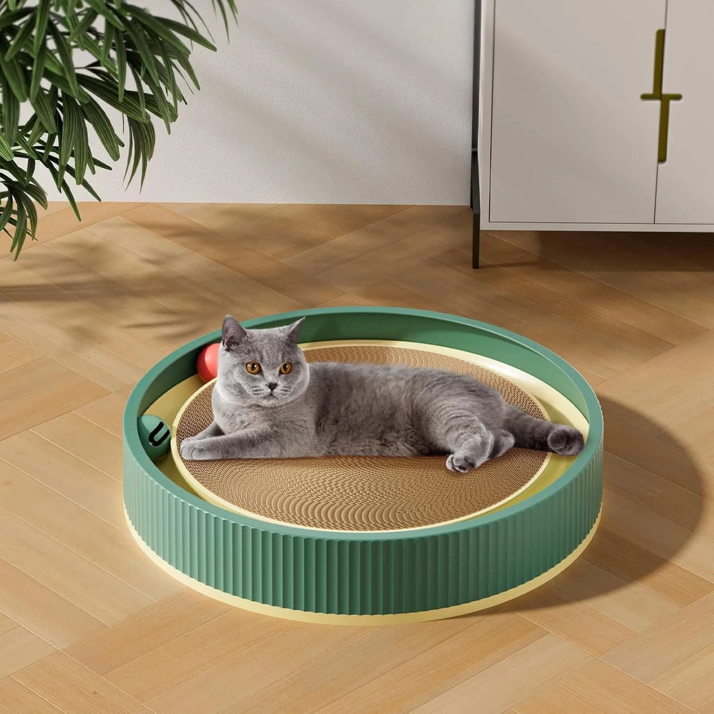 Large circular green cat scratching board with integrated ball toys measuring 45cm diameter
