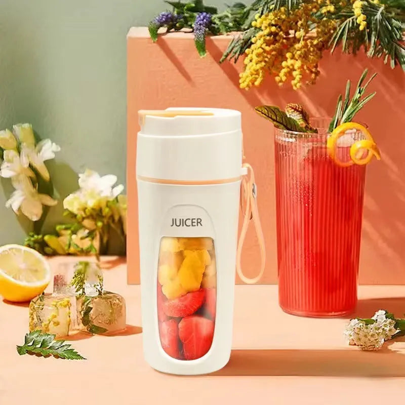 Portable electric juicer cup with USB cable in fresh orange, grass green, or light purple colour.