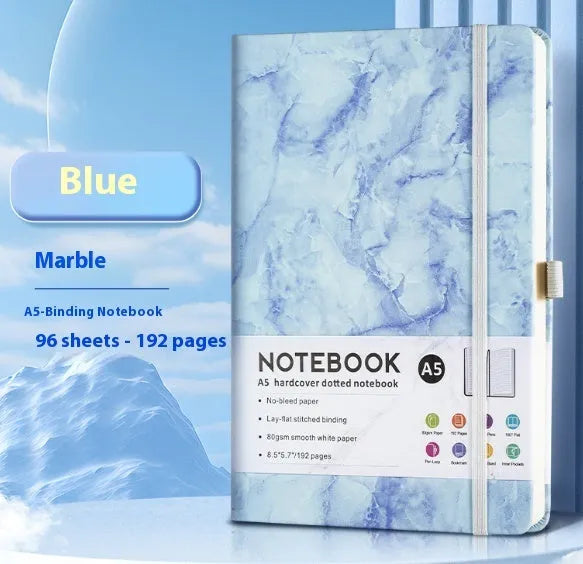 A5 size notebook with soft skin-feel PU leather cover and strap closure, open to show horizontal lined pages.