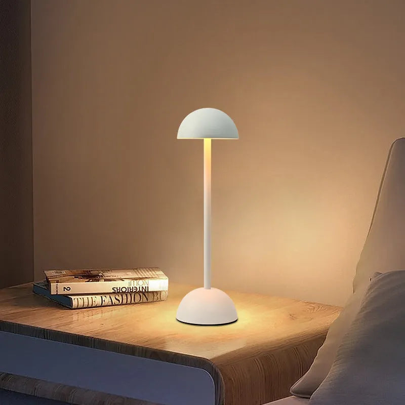 Creative high foot metal mushroom table lamp in white with Type-C power cable on a bedside table