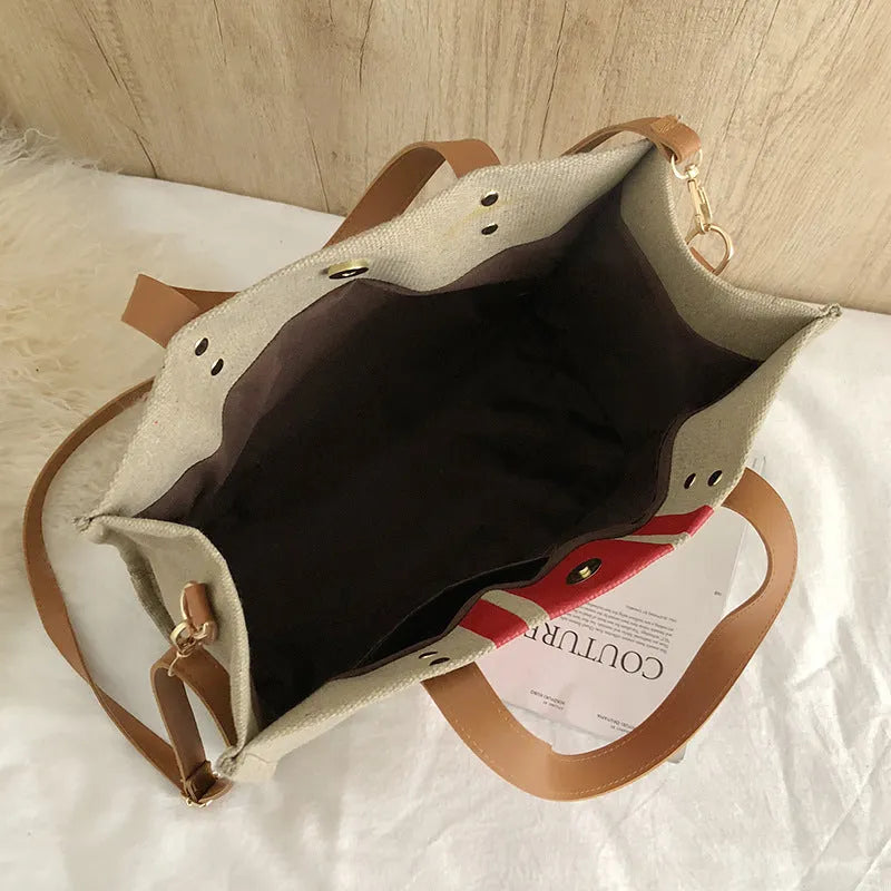 Canvas stripe tote bag in black and white with zipper closure, horizontal square shape, and 120cm shoulder strap