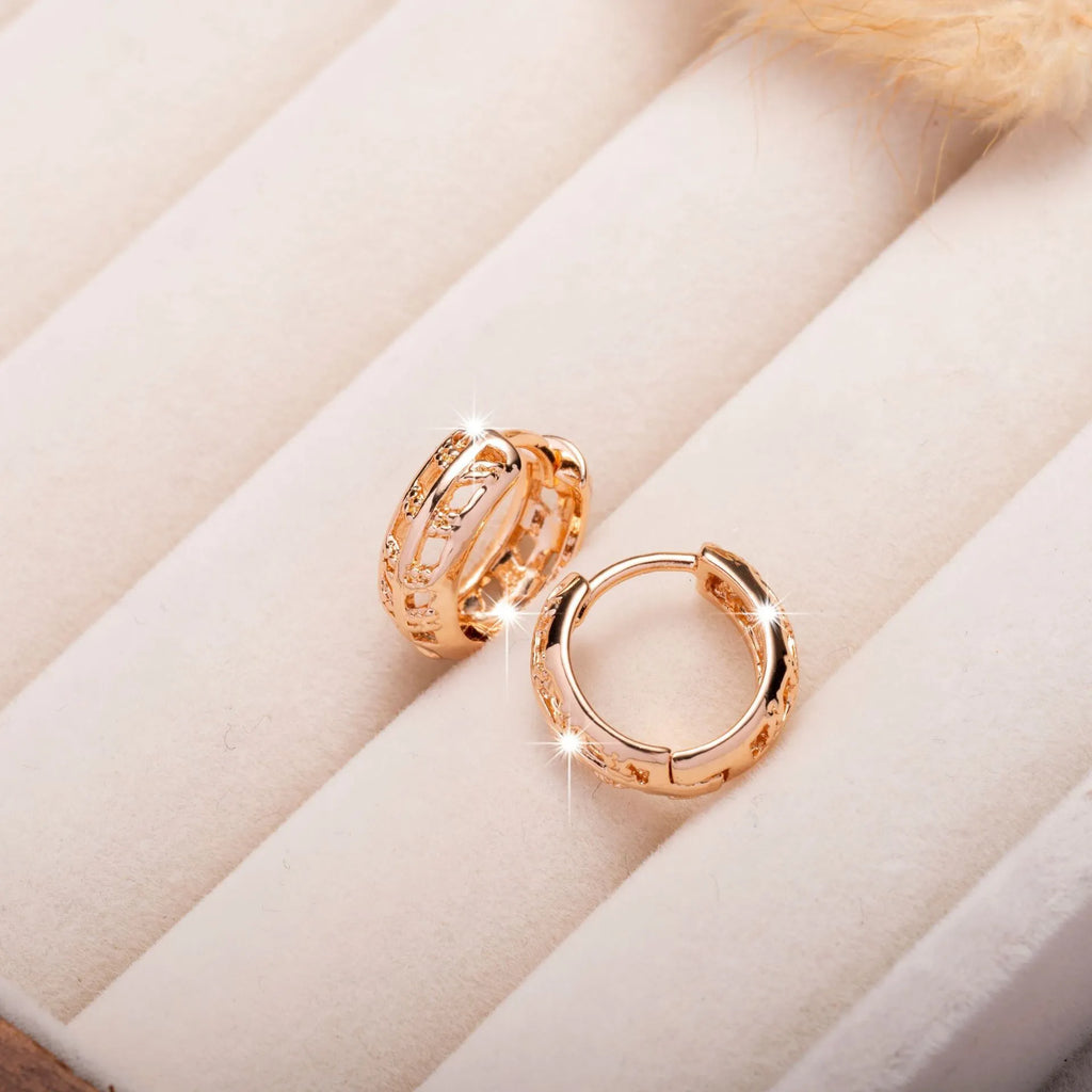 Small rose gold copper earrings with hollow heart and leaf design