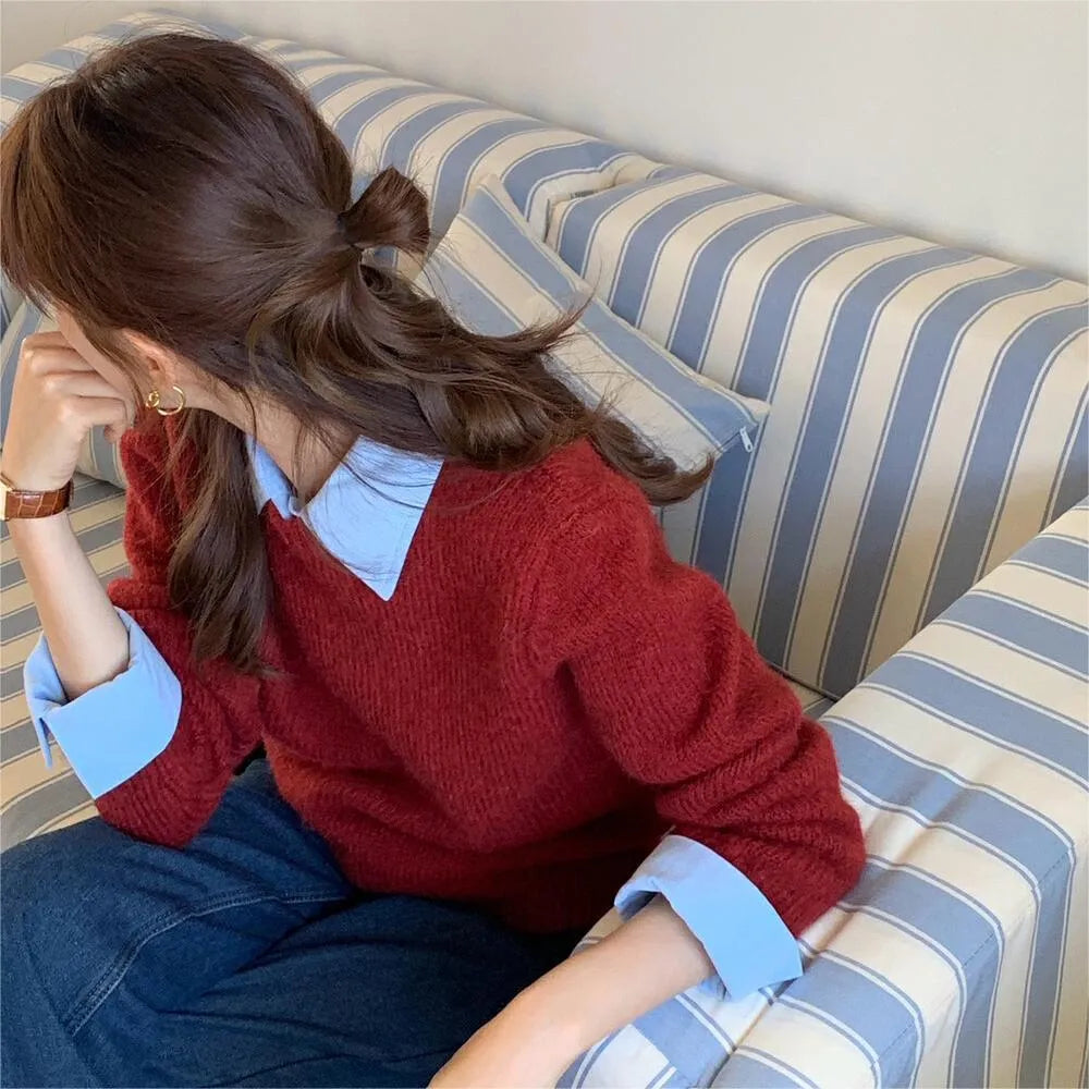 Women's loose-fit knit top with contrast lapels in navy blue, showing front design.