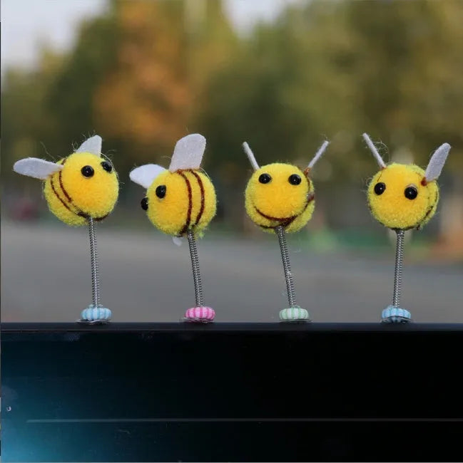 Soft fur ball Swing Spring Bee car decoration ornament measuring 3 by 3 centimetres.