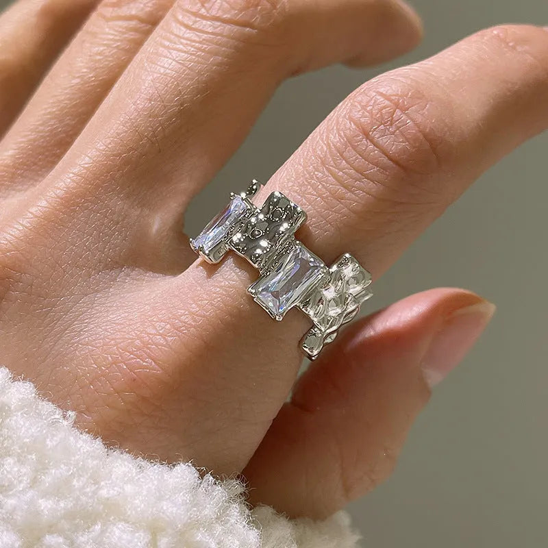 Geometric open ring with zircon stones and silver-plated finish