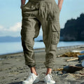 Men's casual linen trousers with ankle ties and multiple pockets in solid colour options