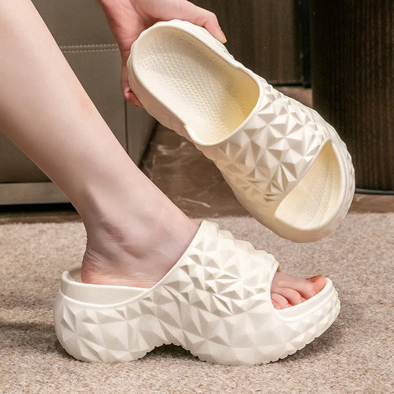 Khaki coloured EVA high heel flip flop slippers with a thick, textured sole.