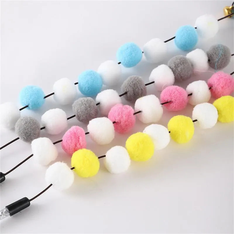 31cm long cat teaser stick with acrylic pompon and feather attachments in contrasting colours