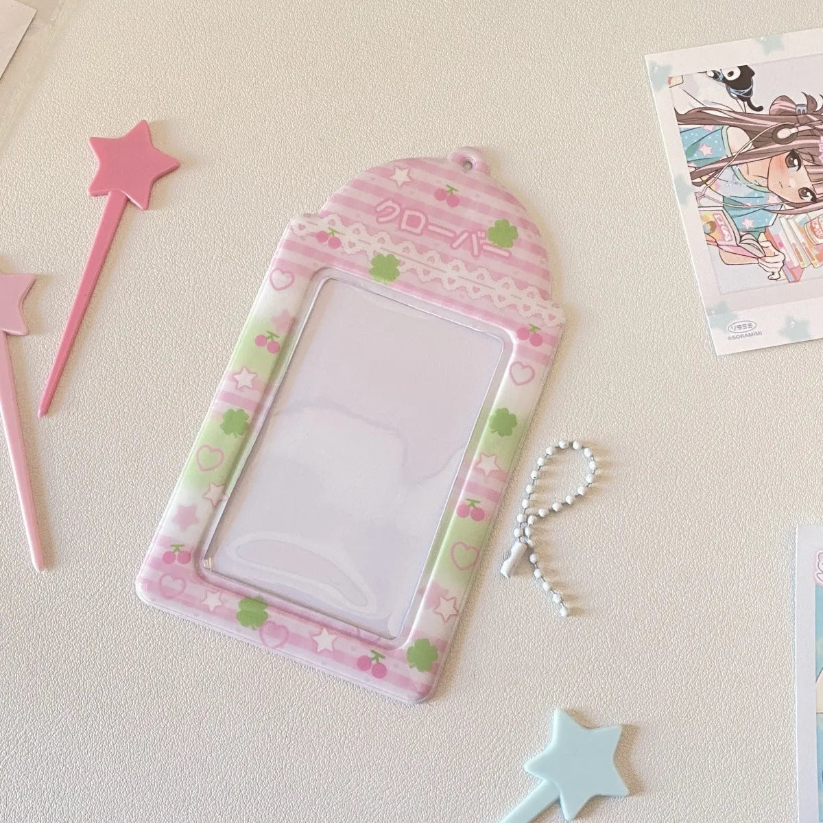 Cartoon strawberry and four-leaf clover PVC meal card holder pendants showing 3-inch card window