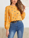 Women's green long-sleeved loose shirt with butterfly print pattern.