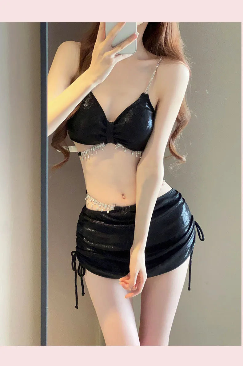 Women's solid colour bikini swimsuit set in black or pink, made from polyester fabric.
