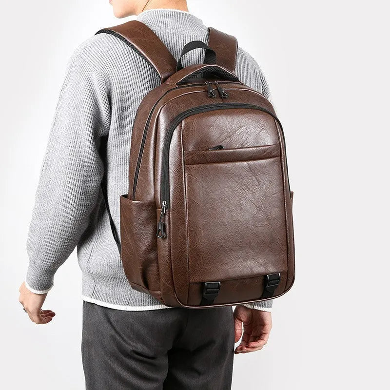 Men's large capacity PU backpack in khaki, 47x33x18cm, with curved shoulder straps and main compartment opening