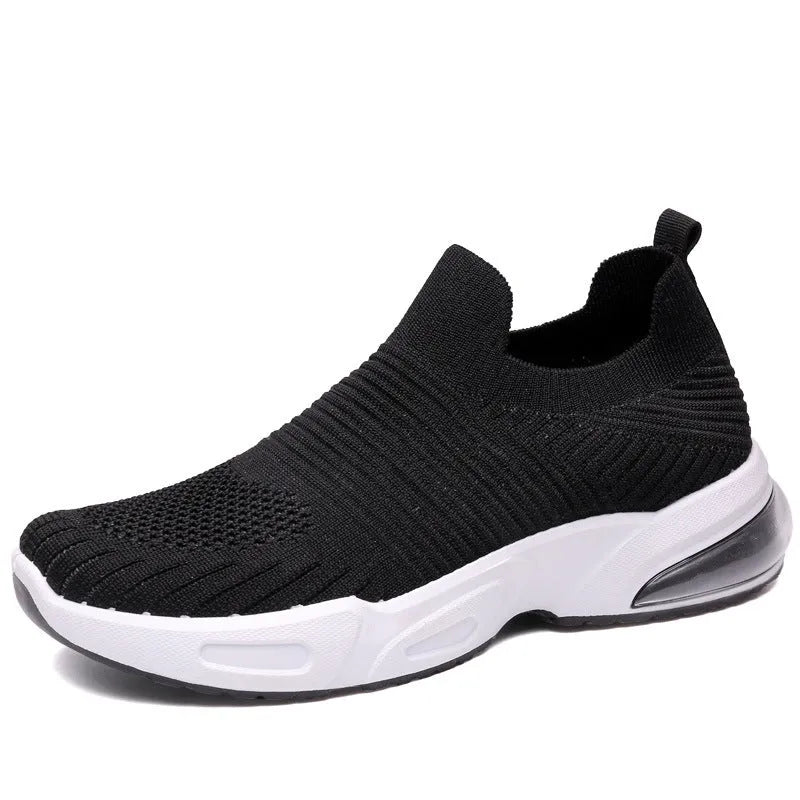 A pair of low-top slip-on sock shoes in a choice of colours, showing the mesh lining and lightweight PVC sole.
