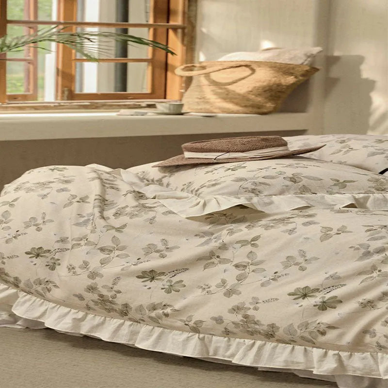 Cotton linen yarn-dyed printed four-piece bedding set in Raw Jute Colour with plants and flowers pattern on a bed