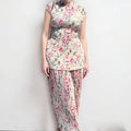 Long sleeve floral print chiffon dress and skirt set on a hanger.