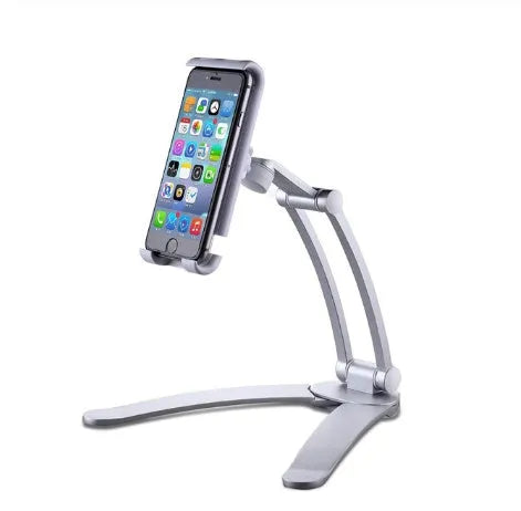 Silver aluminium desktop stand holding a tablet at an angle on a wooden desk.