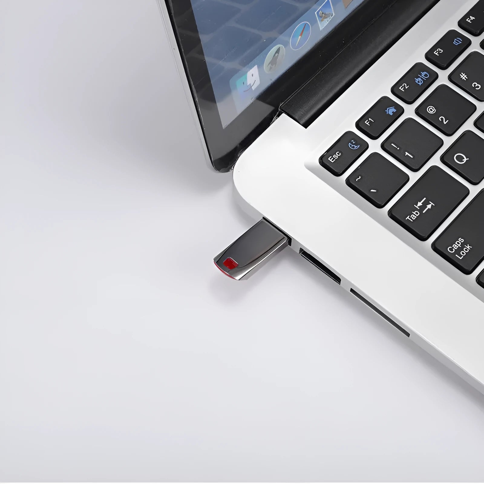 Silver metal USB flash drive with large capacity up to 2TB shown on a dark background