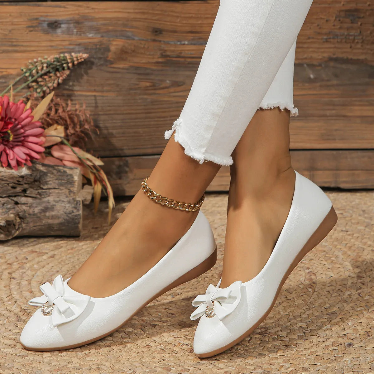 Women's beige casual flat shoes with a bowknot detail on the artificial PU upper.
