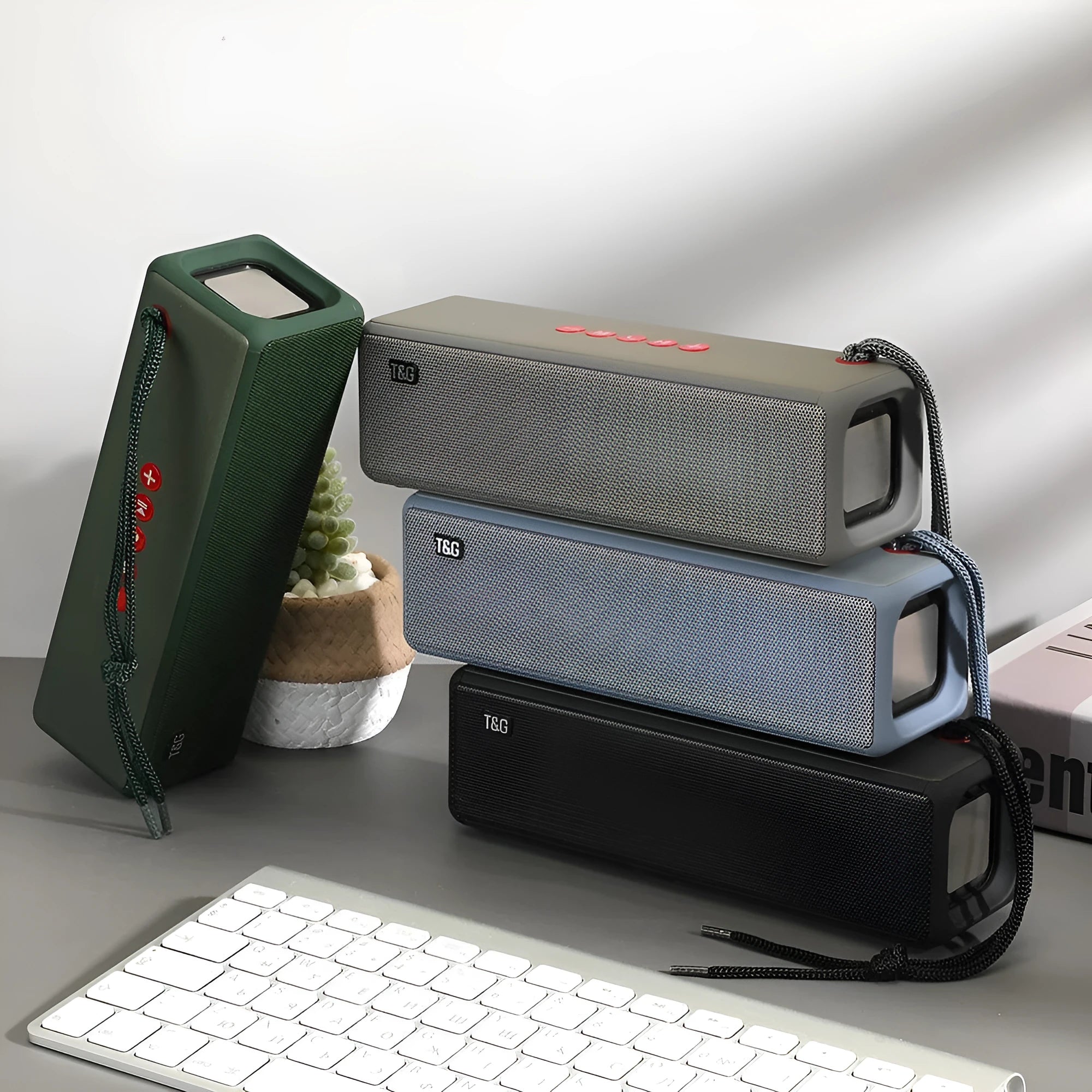Square portable Bluetooth mini speaker in black with braided rope, FM radio, and power bank function