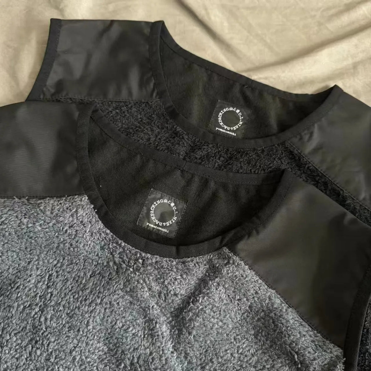 Men's lightweight fleece lined thermal vest in solid colour black, front view