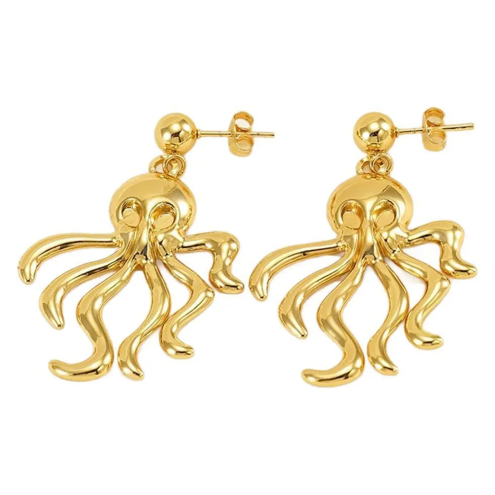Gold stainless steel octopus drop earrings on a neutral background