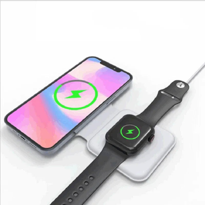 White foldable magnetic wireless charging dock with a phone attached and earbud case on the base.