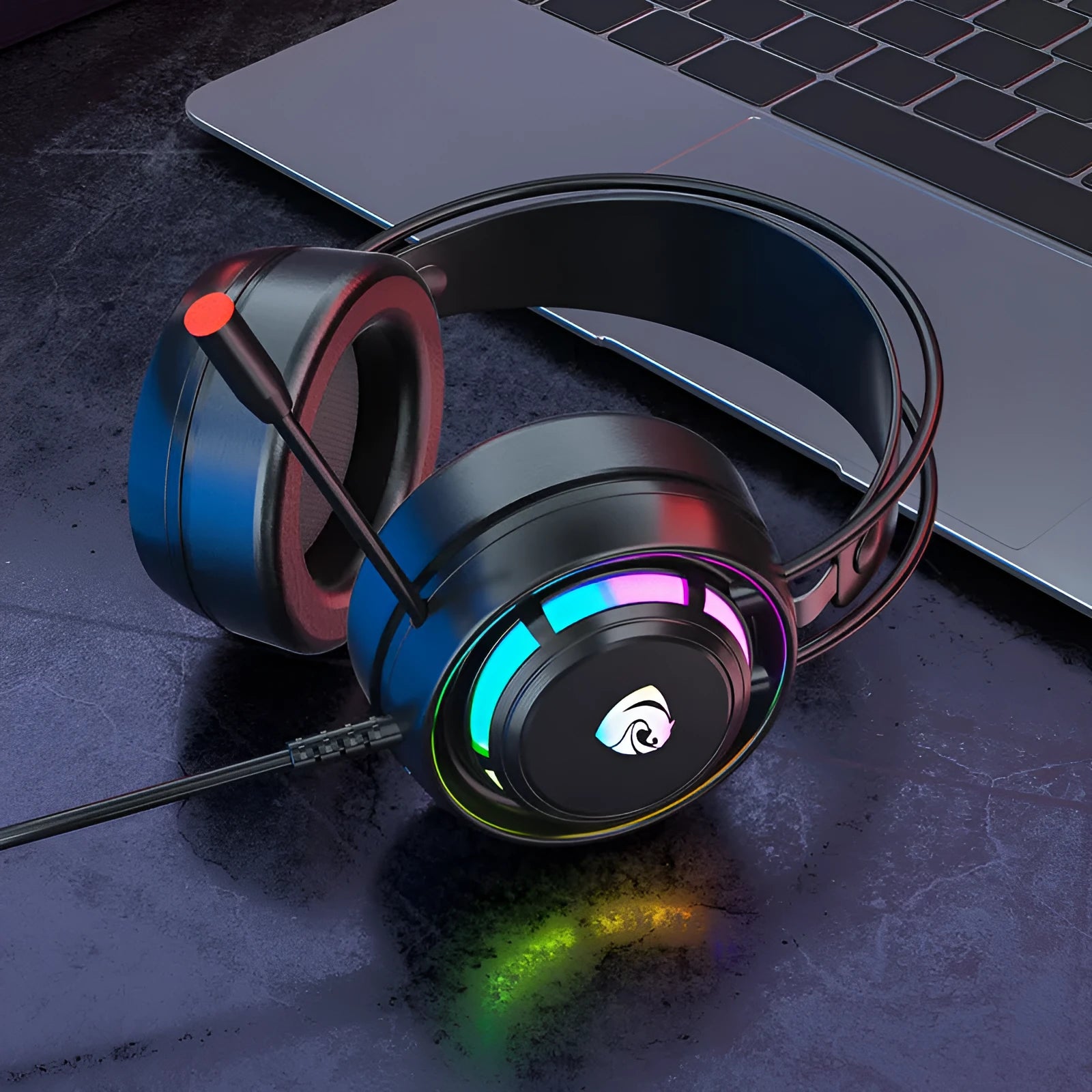Black wired over-ear gaming headset with microphone, foam ear cushions, and a long cable with 3.5mm and USB plug options.