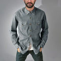 A khaki-coloured cotton denim cardigan coat with an open front, shown on a hanger.