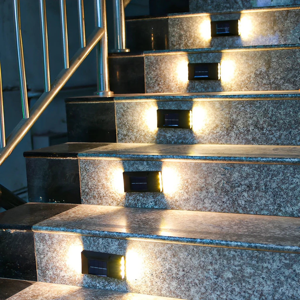 Solar-powered outdoor garden wall light in plastic or stainless steel with LED illumination